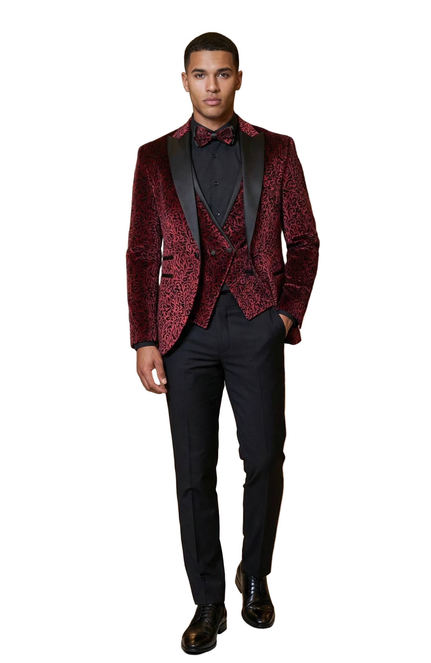 Man in a red patterned suit standing in a luxurious interior setting