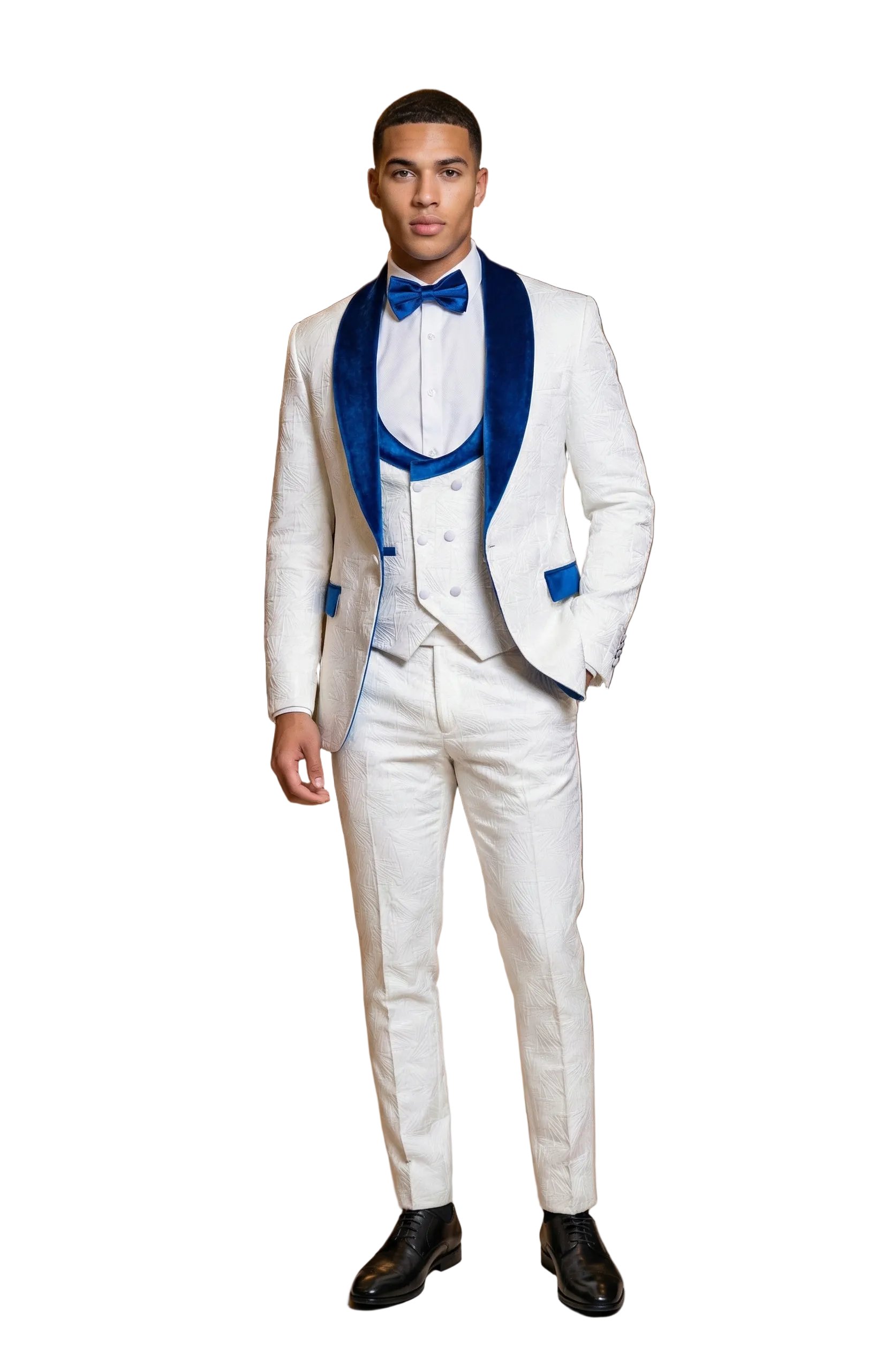 Man in a white suit with blue lapels standing in an elegant room with chandelier.