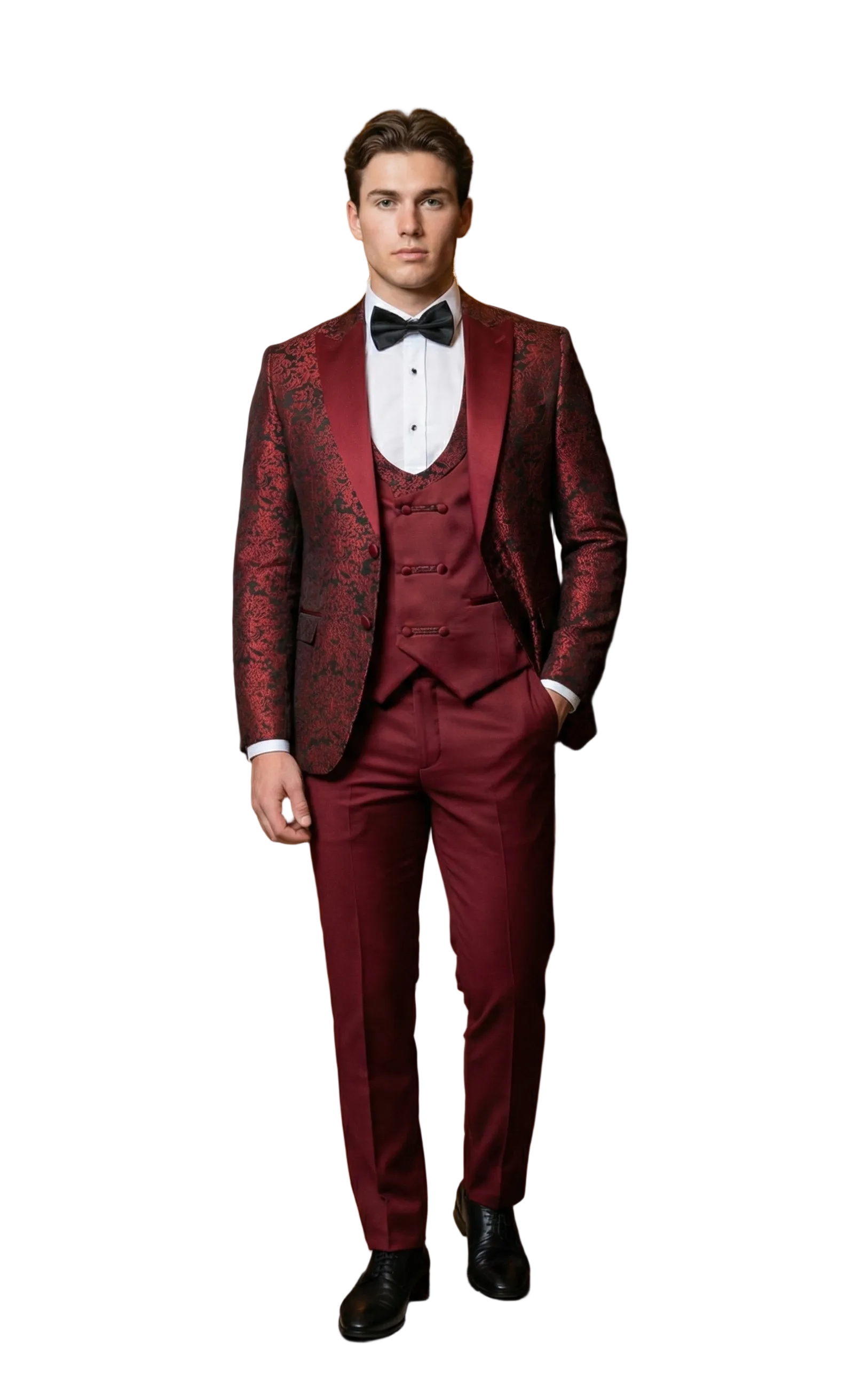 Man in a burgundy suit standing in an elegant room with chandelier